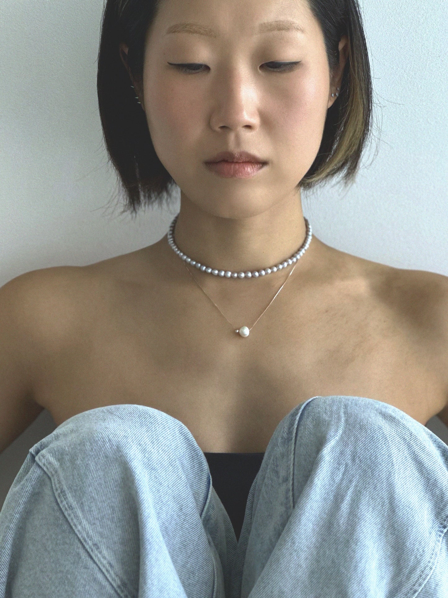 Pryte freshwater pearl necklace worn on the neck