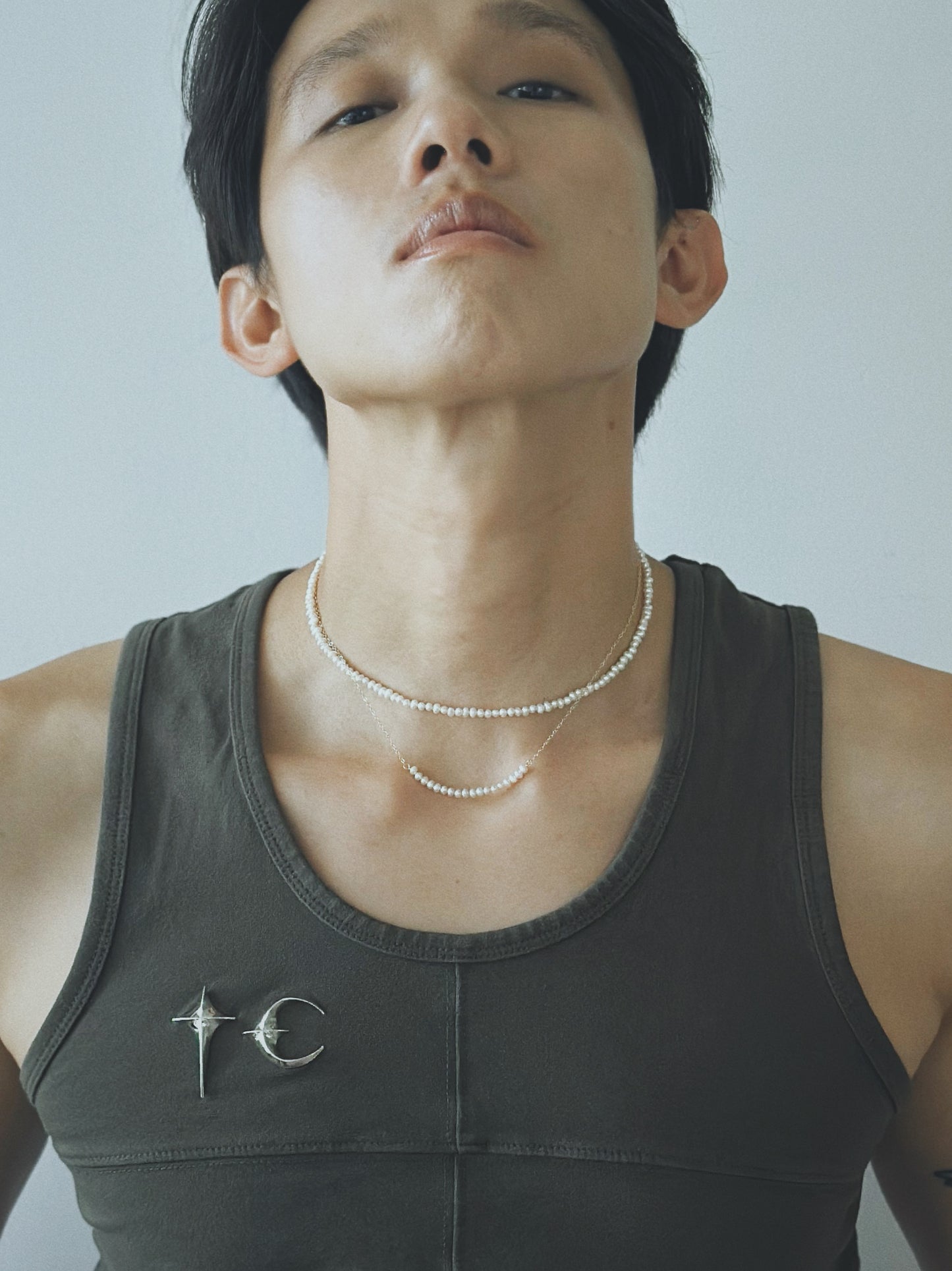 Pryte white freshwater pearl necklace worn on the neck