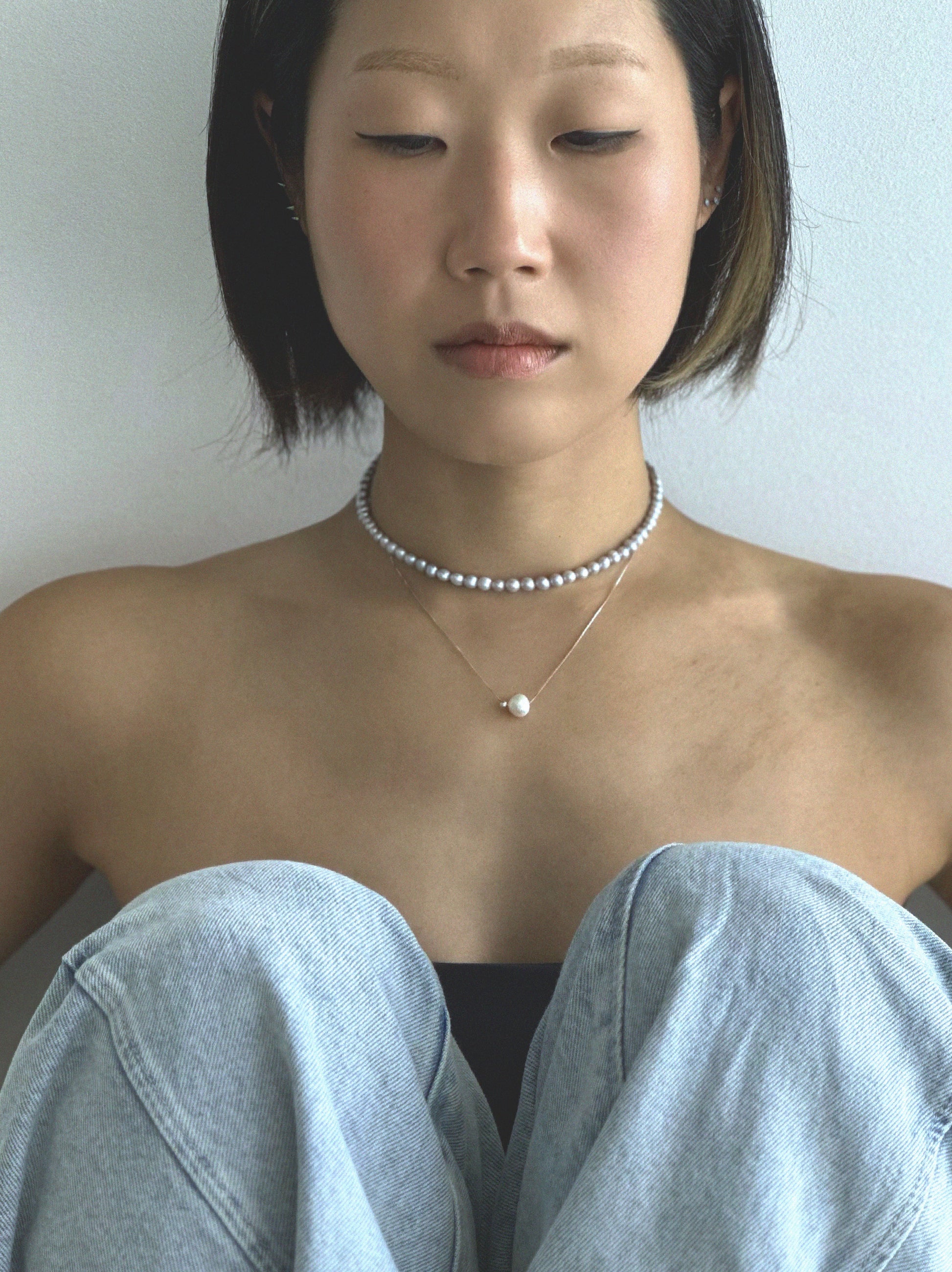 Pryte freshwater pearl necklace worn on the neck