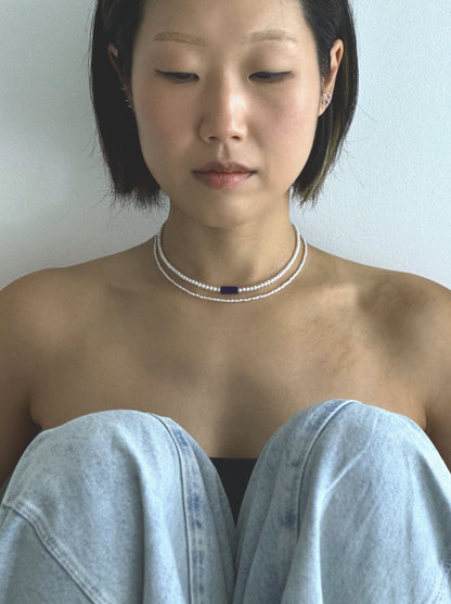Pryte freshwater pearl necklace worn on the neck