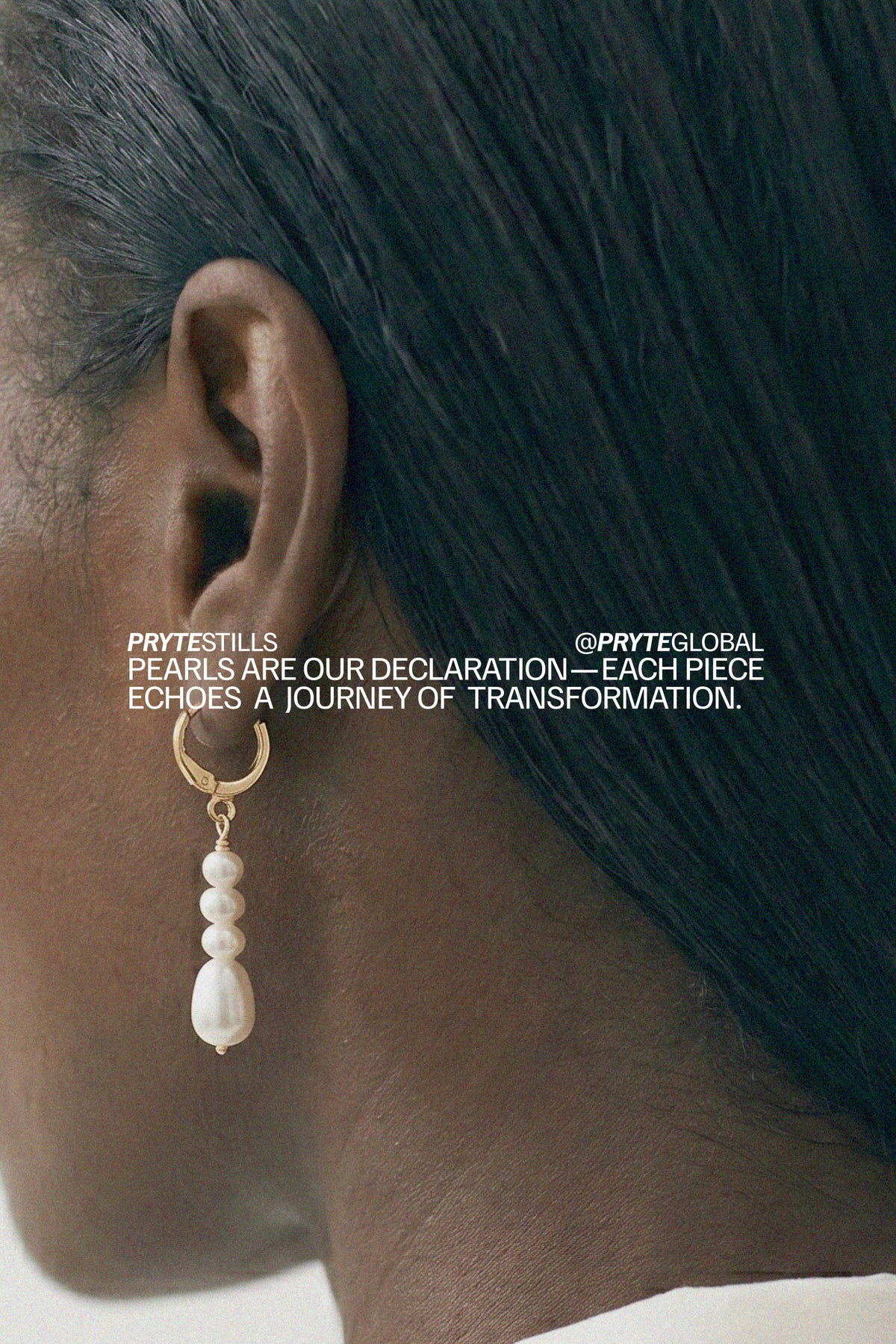 Pryte Medium Anchor Earrings worn by a person with text overlay about Pryte Global brand.